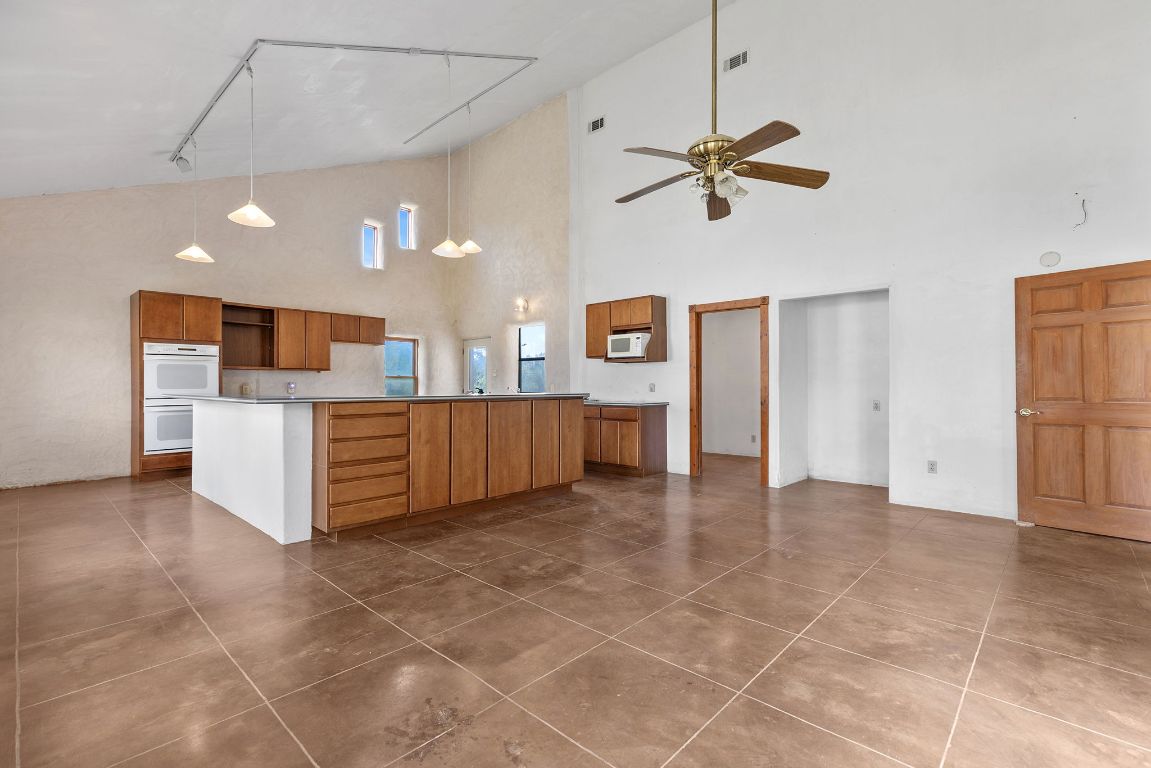 1400 Cobb Creek Road Georgetown, TX 78633 - Photo 14 of 38 a view of a kitchen with a sink and cabinets
