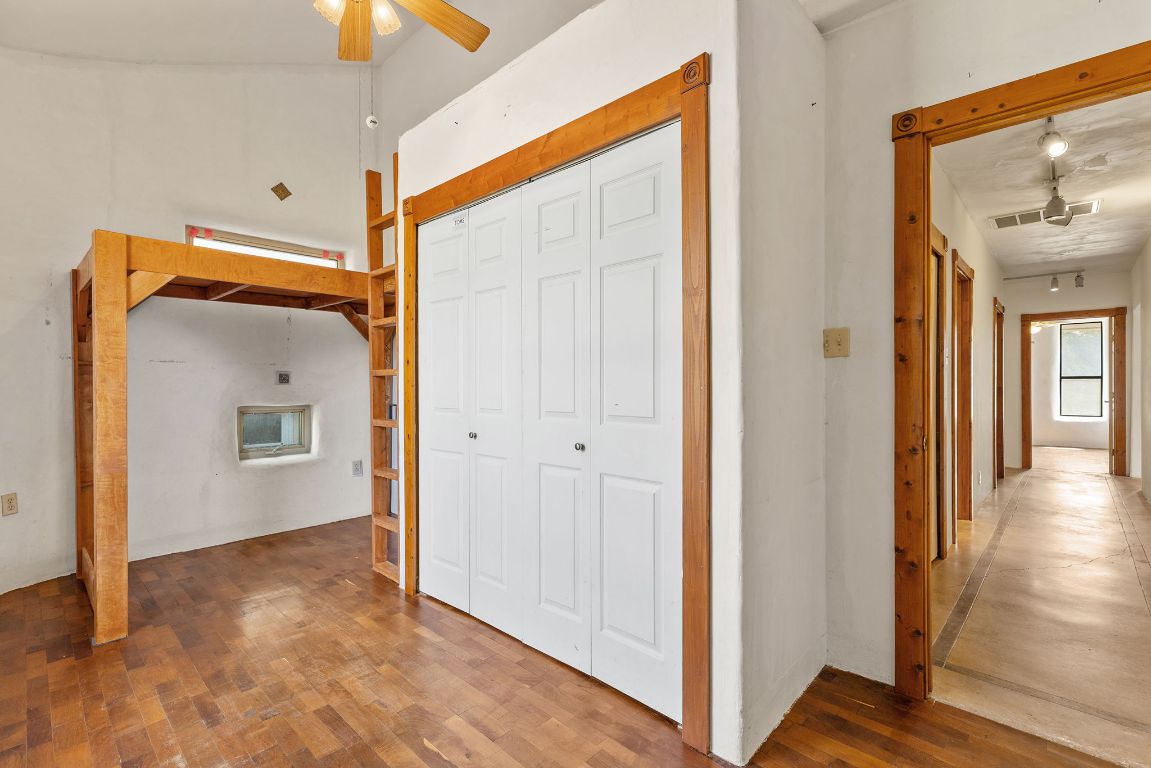 1400 Cobb Creek Road Georgetown, TX 78633 - Photo 20 of 38 a view of a hallway with wooden floor and a living room