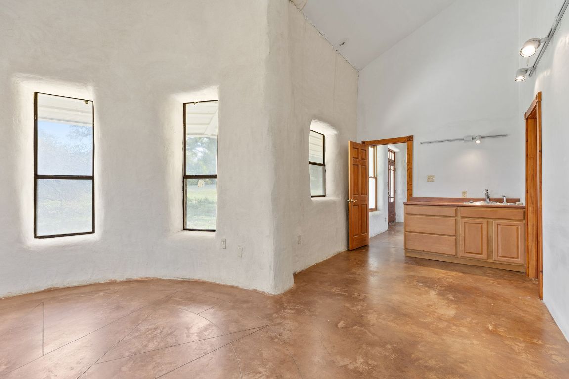 1400 Cobb Creek Road Georgetown, TX 78633 - Photo 10 of 38 an empty room with windows and wardrobe