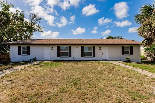 a house view with a garden space