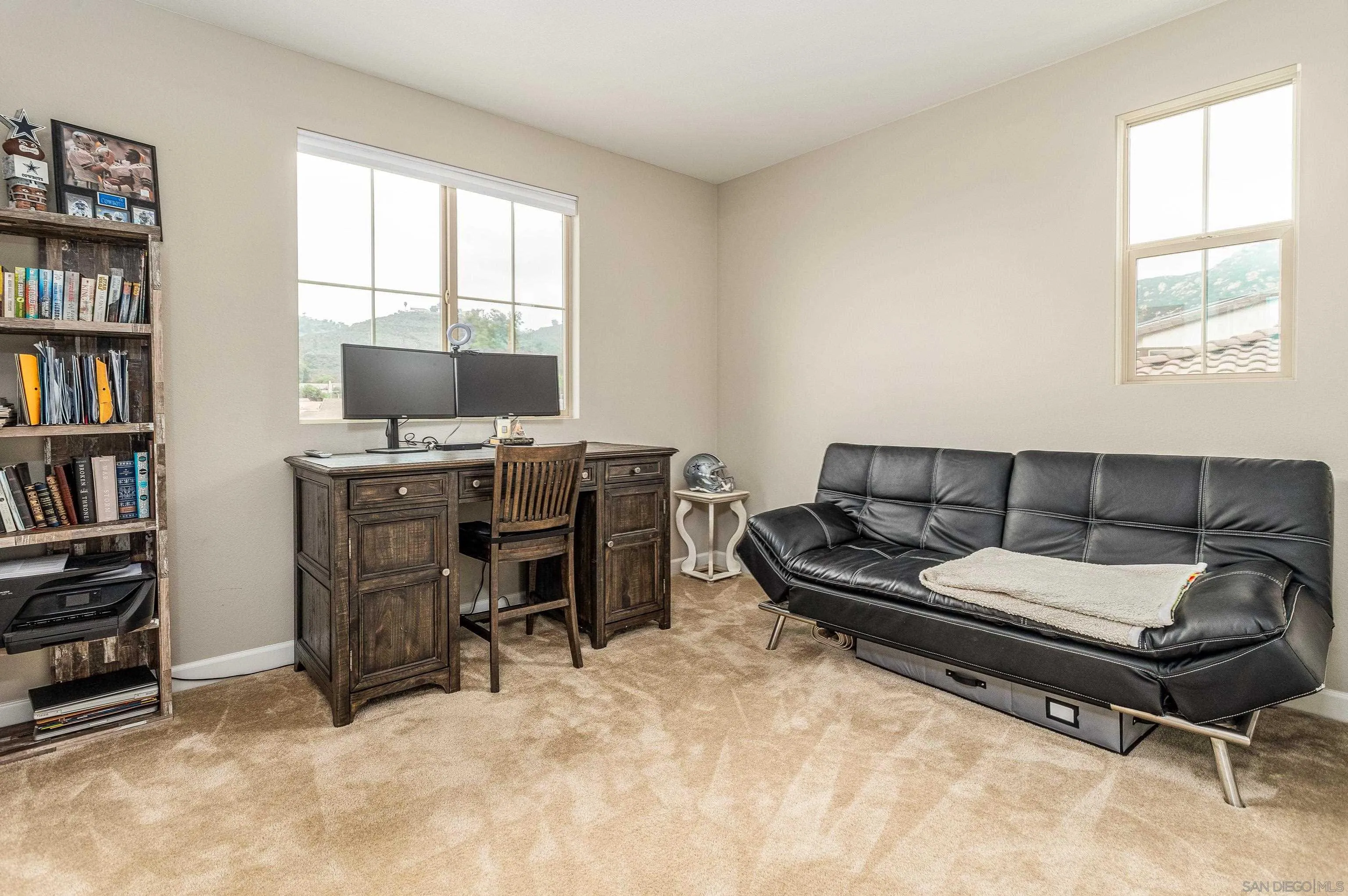 2066 Bruno Place Escondido, CA 92026 - Photo 18 of 33 a living room with furniture a book shelf and a window