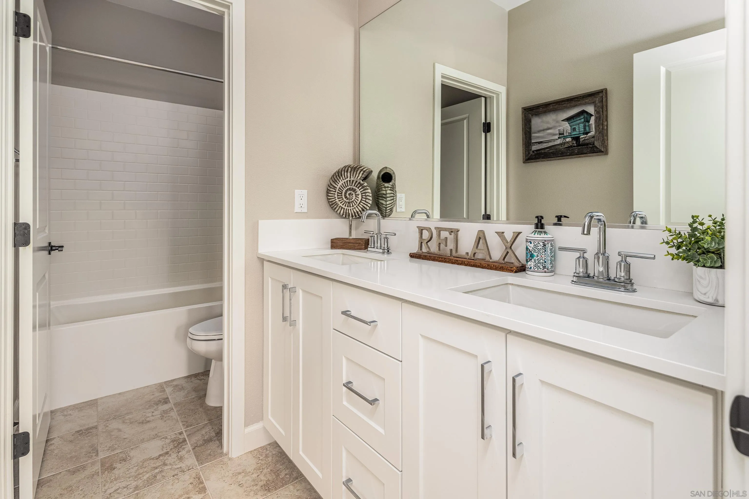 2066 Bruno Place Escondido, CA 92026 - Photo 20 of 33 a bathroom with a granite countertop sink a toilet and a bathtub