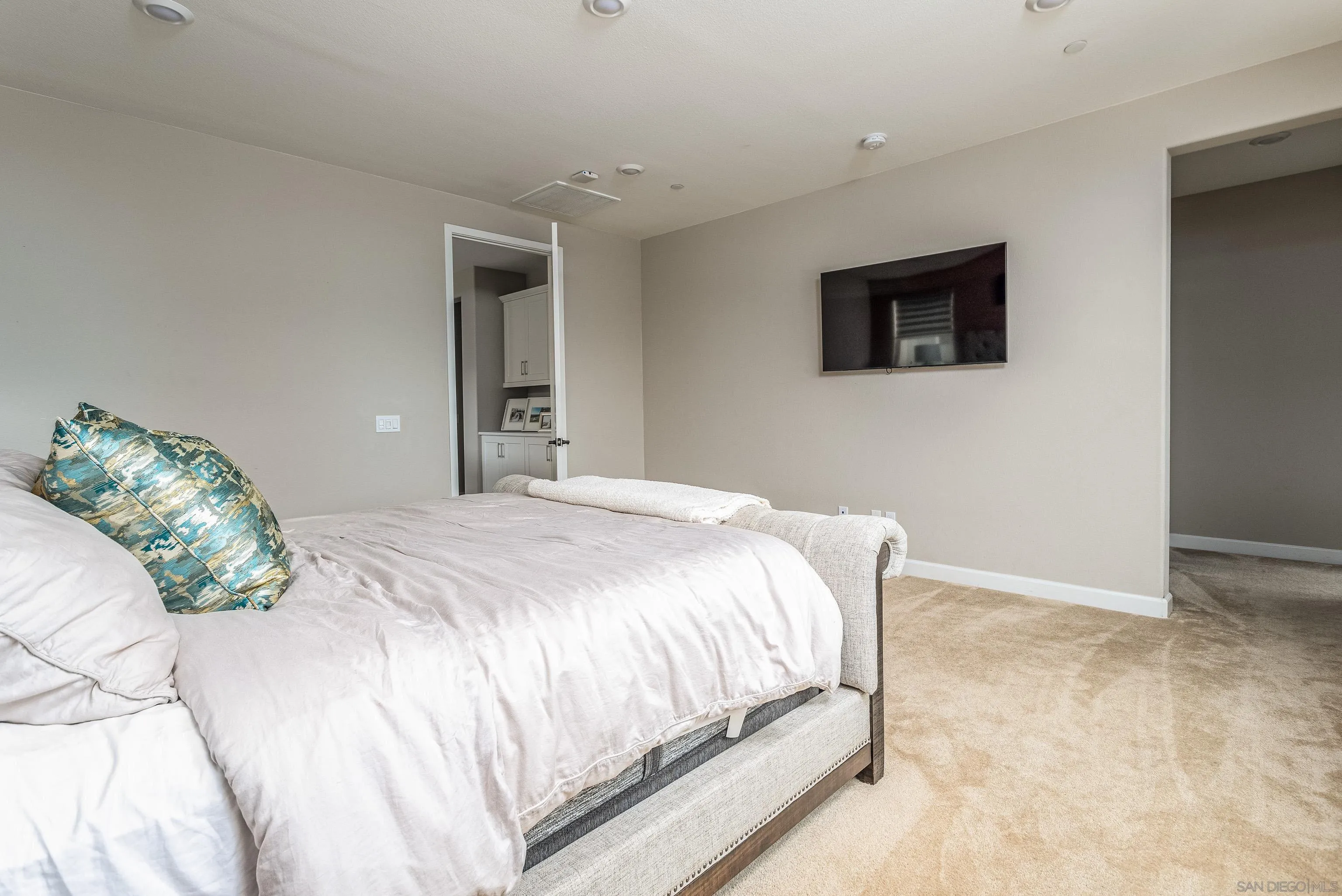 2066 Bruno Place Escondido, CA 92026 - Photo 22 of 33 a bedroom with a bed and a painting on the wall