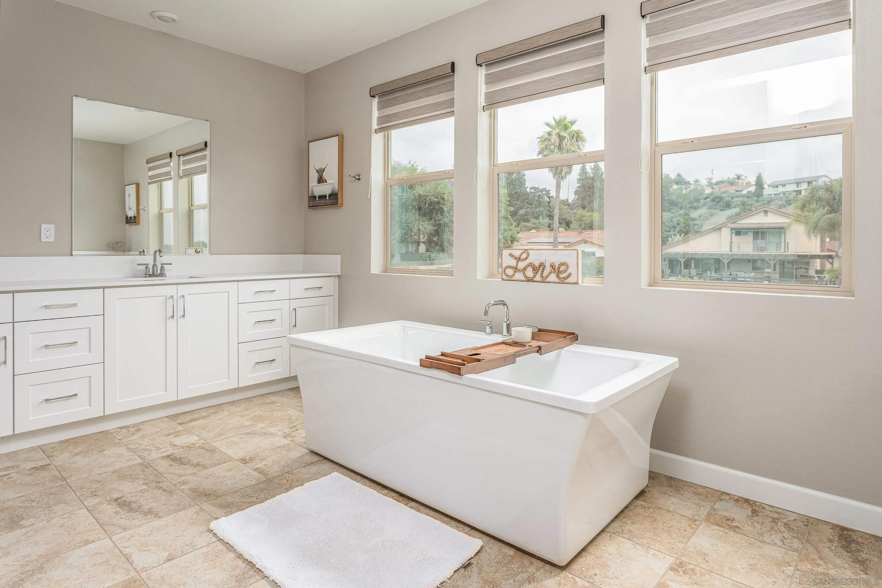 2066 Bruno Place Escondido, CA 92026 - Photo 24 of 33 a utility room with sink dryer and chandelier