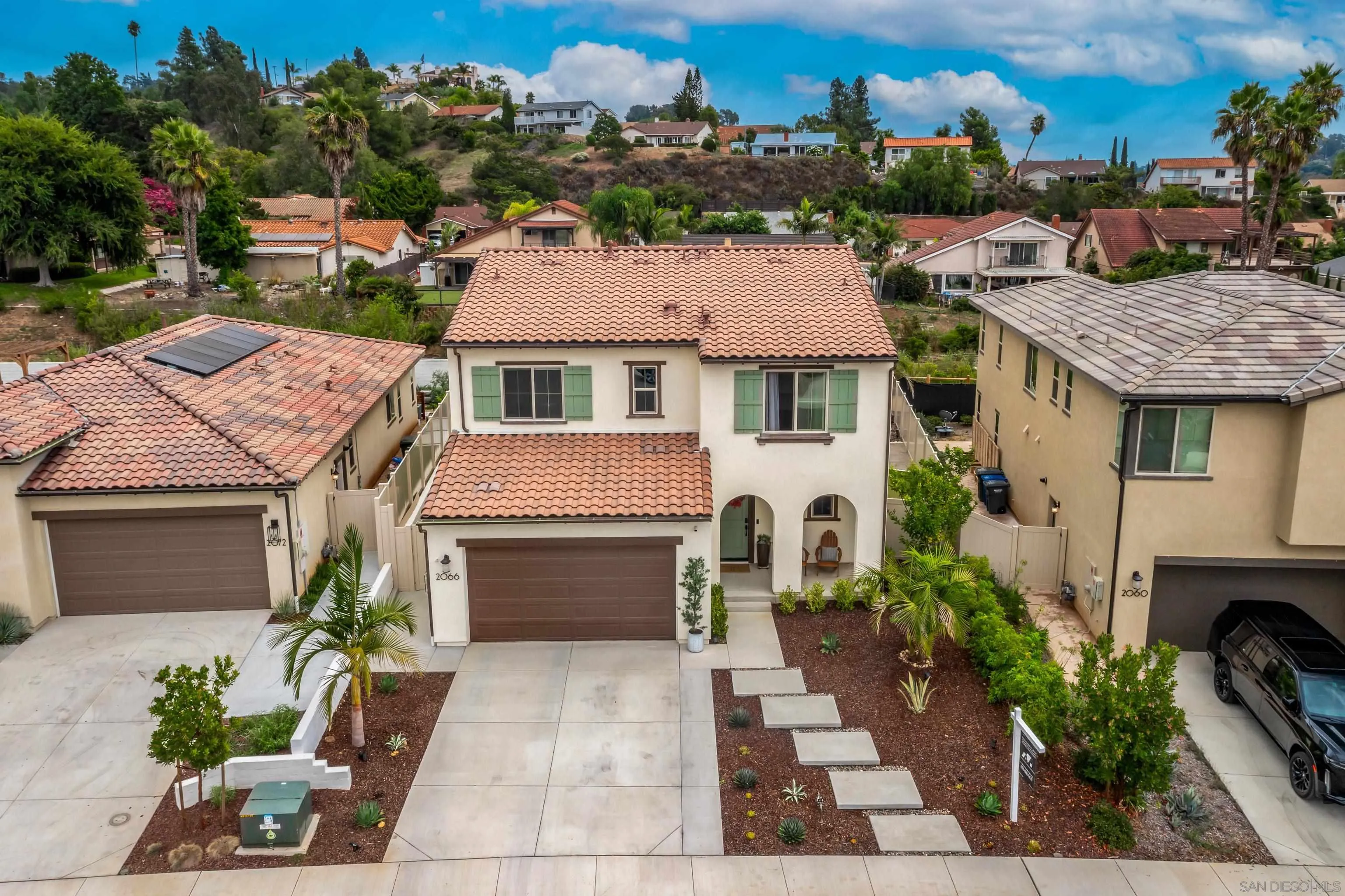 2066 Bruno Place Escondido, CA 92026 - Photo 32 of 33 a aerial view of a house with a yard and a garage