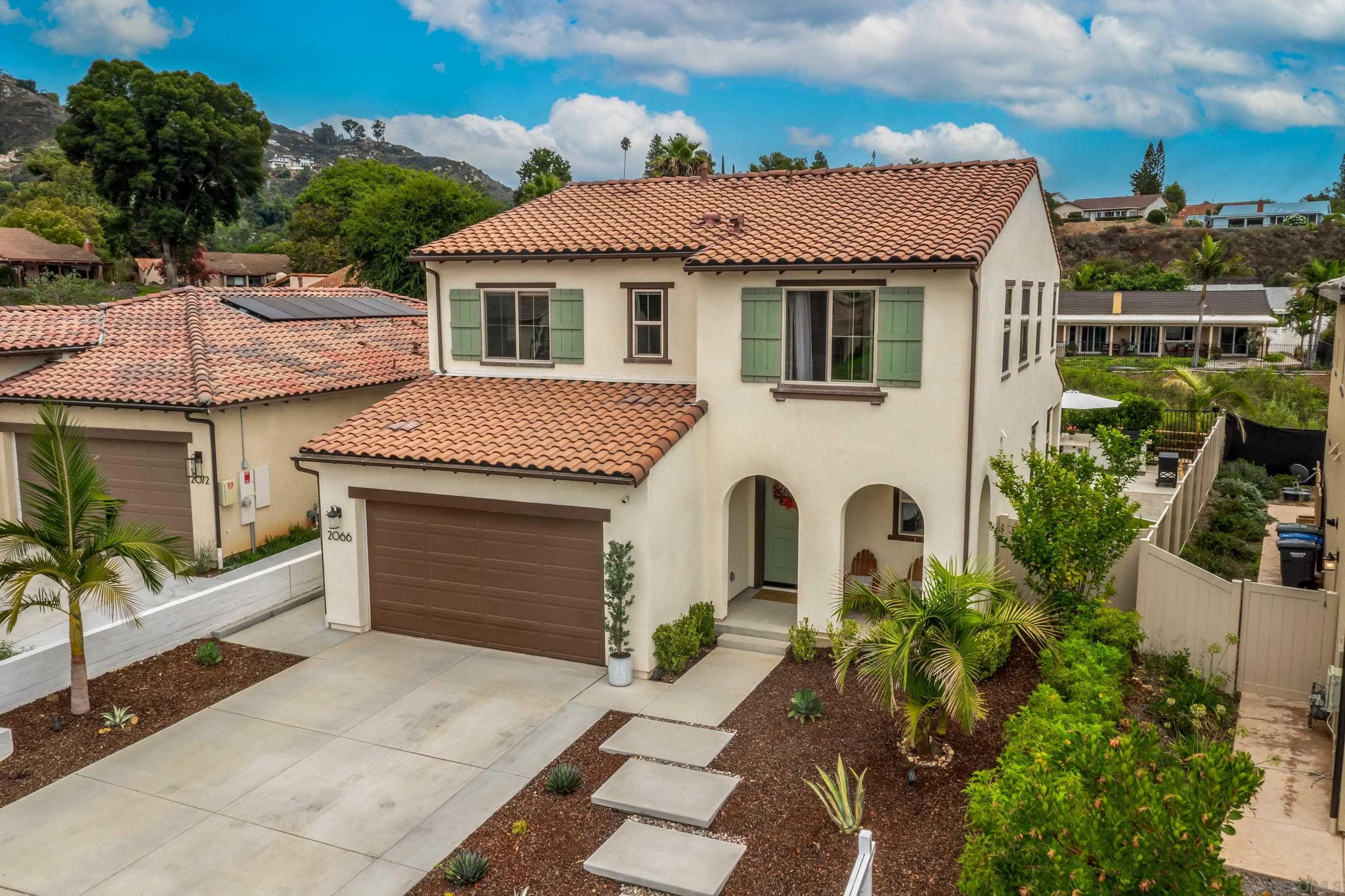 2066 Bruno Place Escondido, CA 92026 - Photo 33 of 33 a front view of a house with a garden