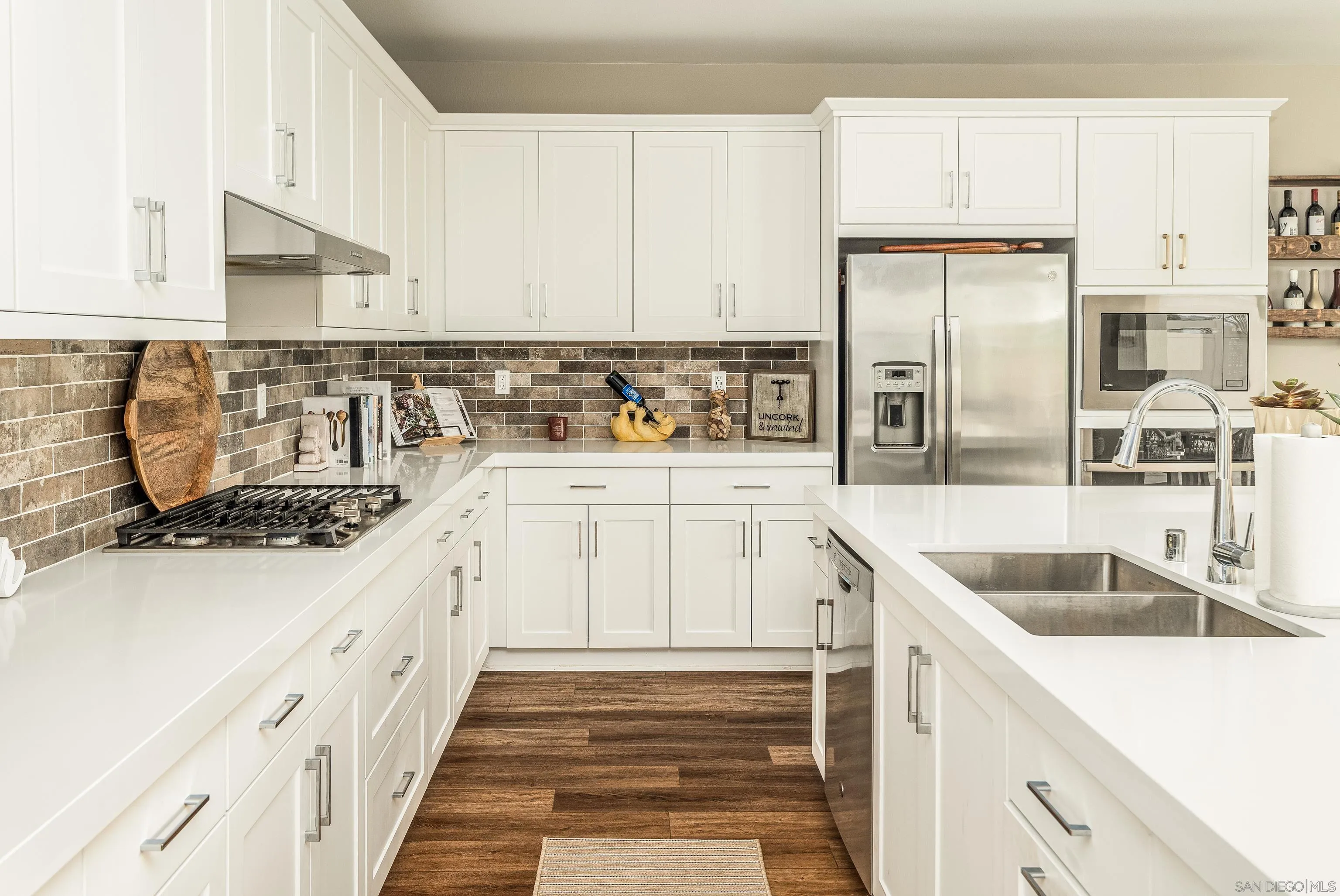 2066 Bruno Place Escondido, CA 92026 - Photo 8 of 33 a kitchen with granite countertop a sink a stove and refrigerator