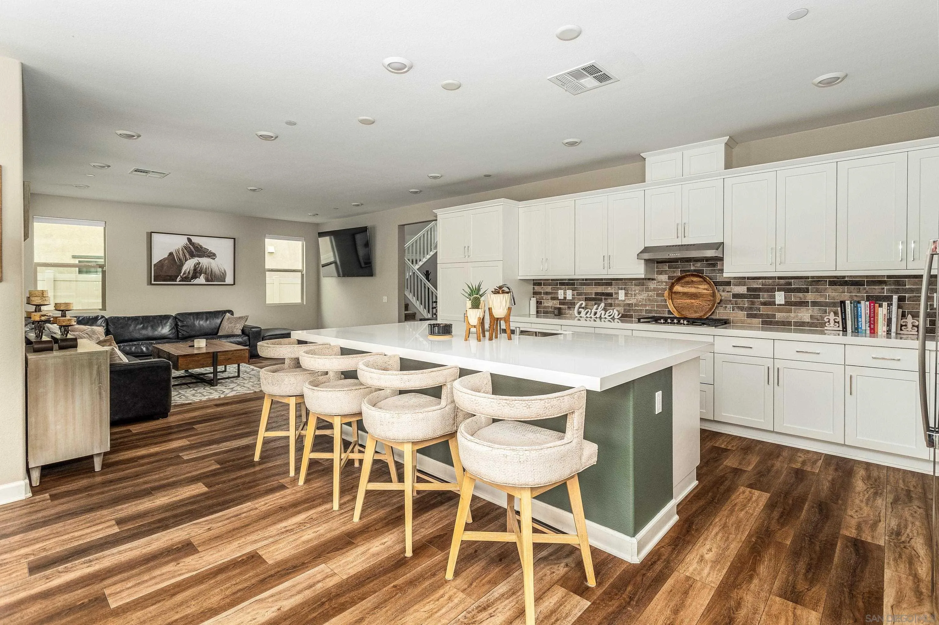 2066 Bruno Place Escondido, CA 92026 - Photo 9 of 33 a kitchen with a sink white cabinets and appliances
