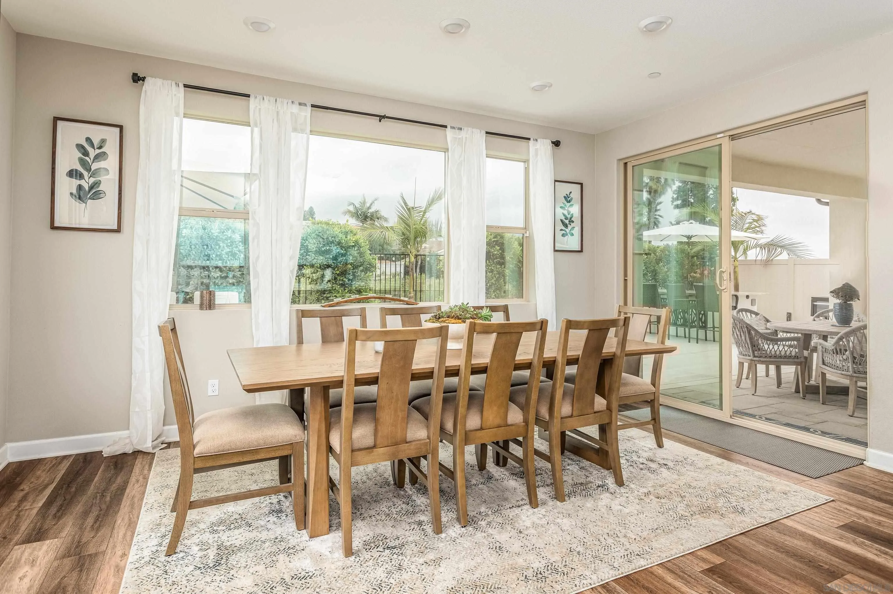 2066 Bruno Place Escondido, CA 92026 - Photo 10 of 33 a view of a dining room with furniture window and wooden floor