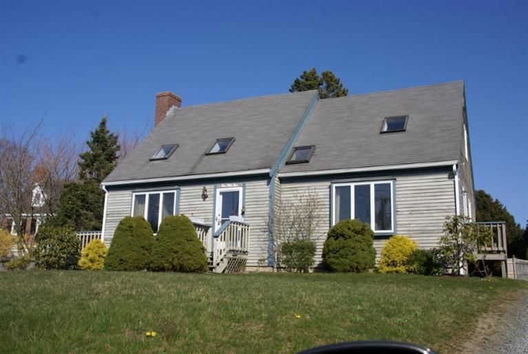 155 Stage Harbor Road Chatham, MA 02633 - Photo 3 of 11 a aerial view of a house next to a big yard