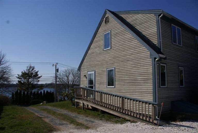 155 Stage Harbor Road Chatham, MA 02633 - Photo 4 of 11 a view of a house with a yard