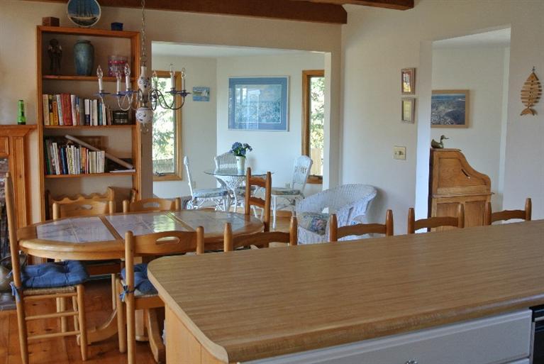 155 Stage Harbor Road Chatham, MA 02633 - Photo 6 of 11 a room with furniture and a book shelf