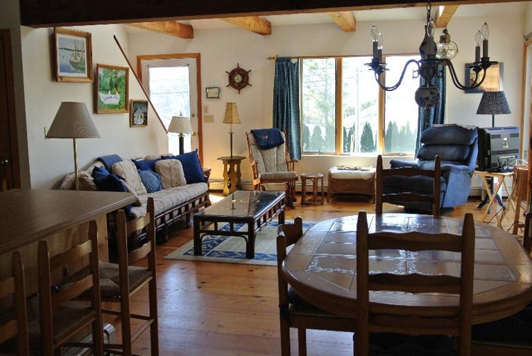 155 Stage Harbor Road Chatham, MA 02633 - Photo 7 of 11 a living room with furniture and a window