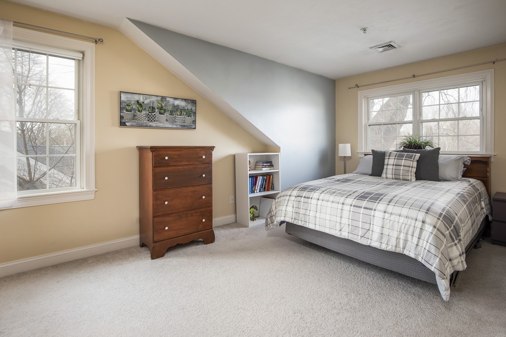 24 Wall Street, Unit E Canton, MA 02021 - Photo 12 of 19 a bedroom with a bed and a window