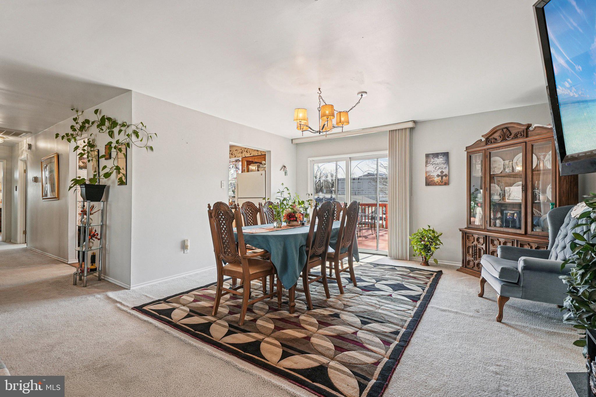 41 Harding Street Ewing, NJ 08618 - Photo 12 of 50 a view of a dining room with furniture and a chandelier