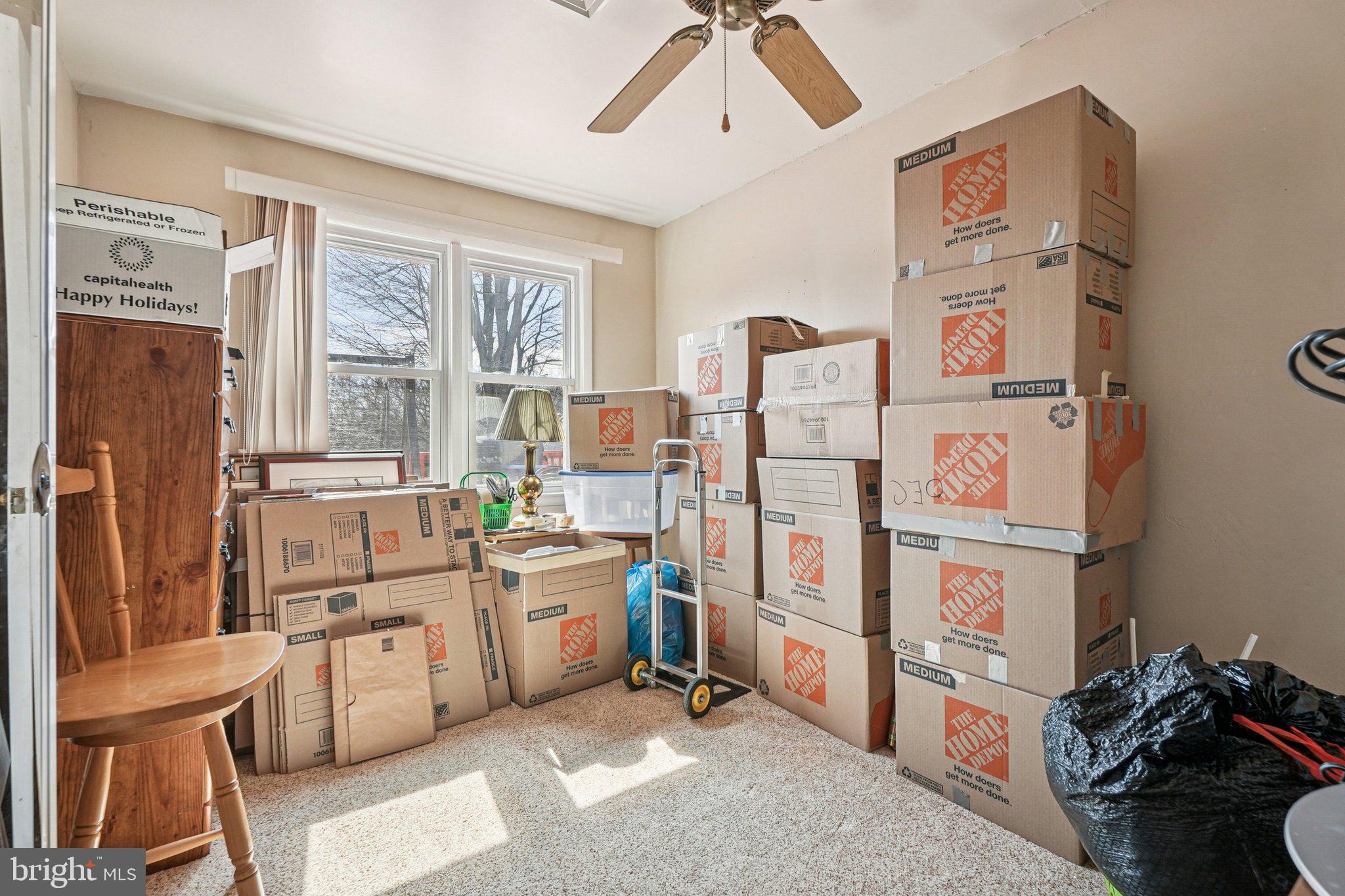 41 Harding Street Ewing, NJ 08618 - Photo 24 of 50 a room with furniture a large window and stainless steel appliances