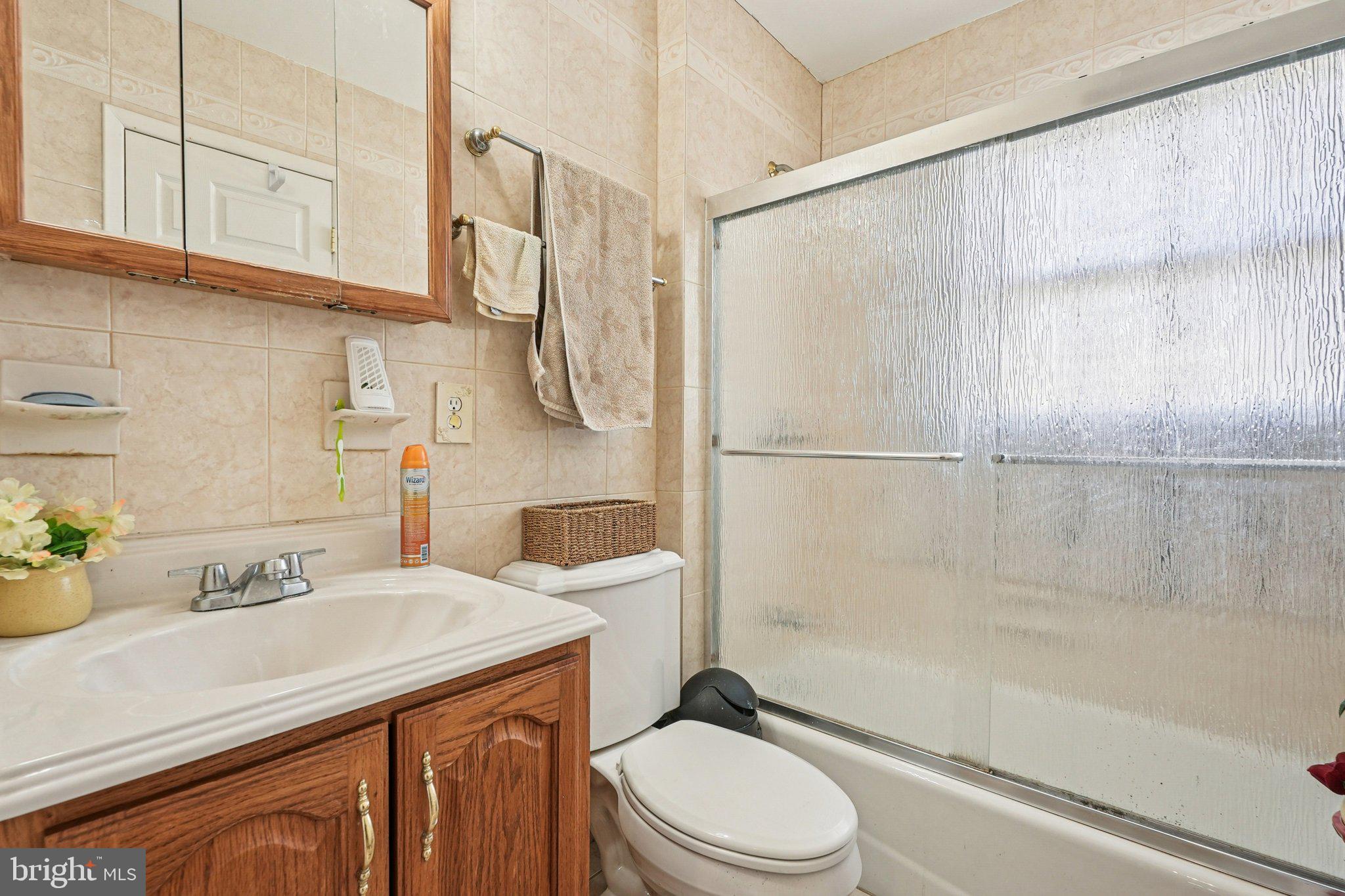41 Harding Street Ewing, NJ 08618 - Photo 25 of 50 a bathroom with a sink a toilet and shower