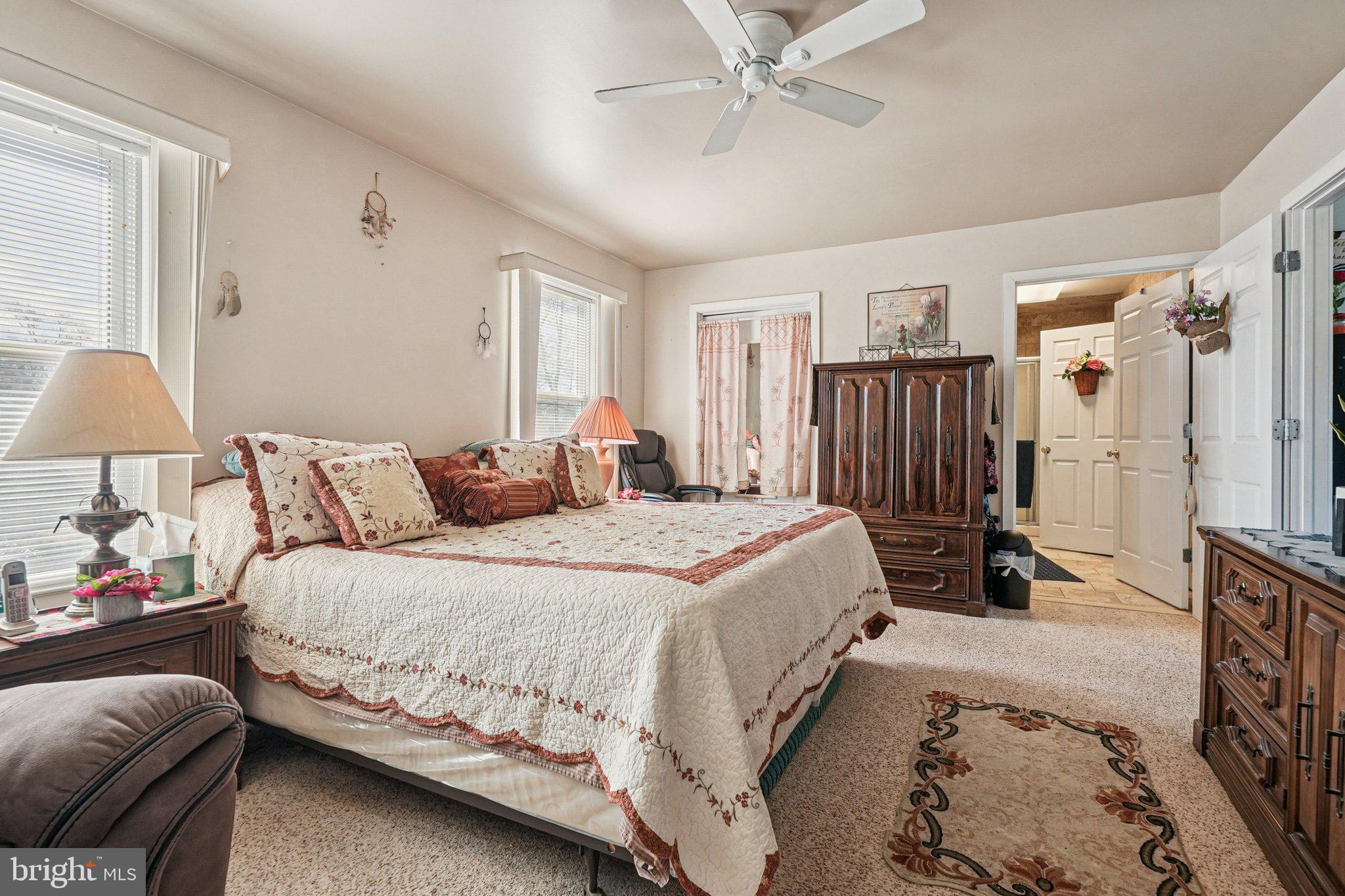 41 Harding Street Ewing, NJ 08618 - Photo 27 of 50 a bedroom with a bed and a chandelier