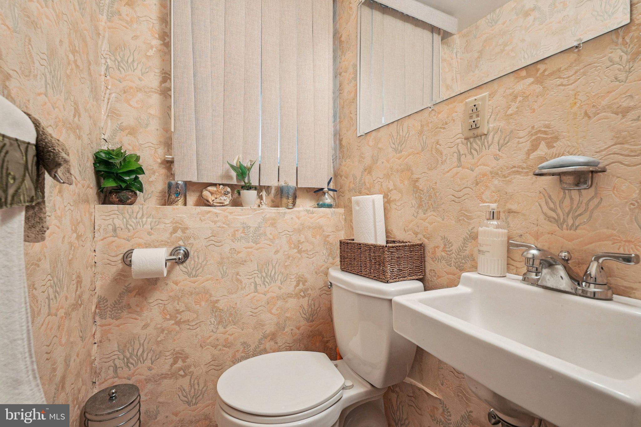 41 Harding Street Ewing, NJ 08618 - Photo 29 of 50 a bathroom with a sink a toilet and a mirror