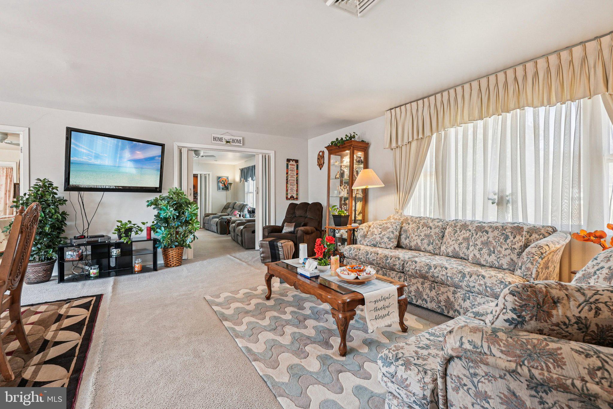 41 Harding Street Ewing, NJ 08618 - Photo 6 of 50 a living room with furniture and a flat screen tv