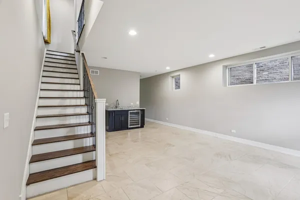 a view of an empty room with stairs