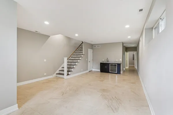 a view of an empty room with a fireplace