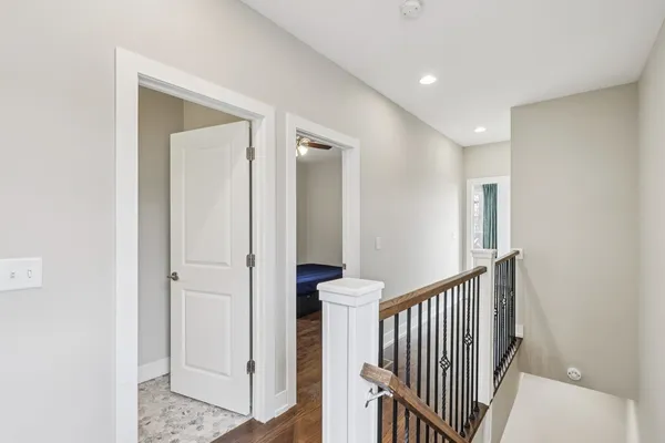 a view of a hallway with entryway door