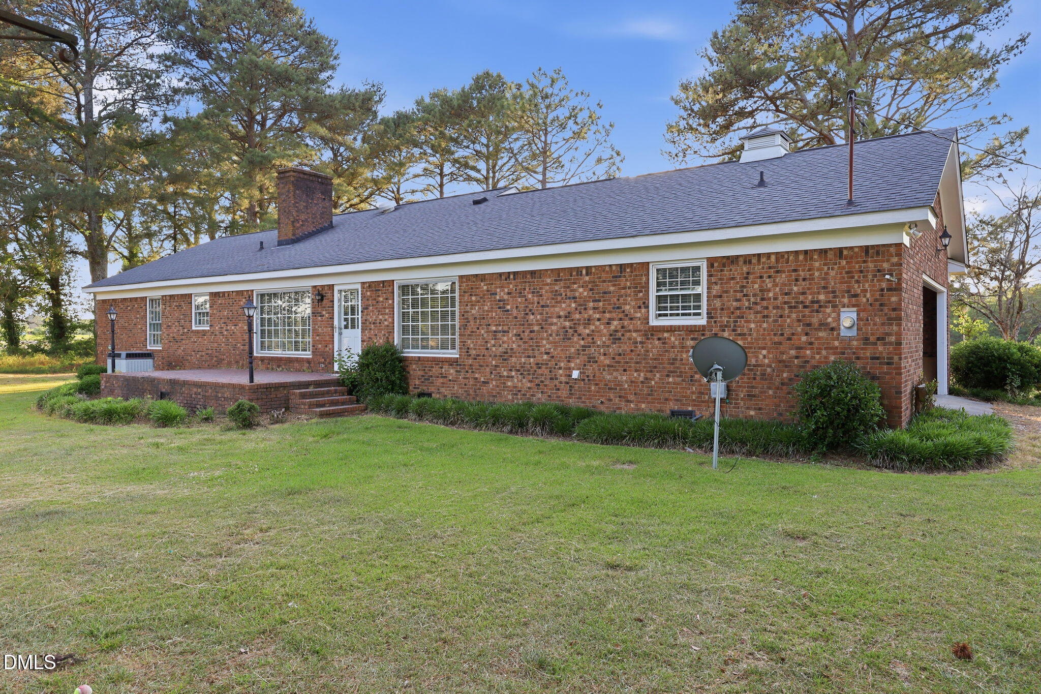 1130 Prospect Church Road Dunn, NC 28334 - Photo 3 of 47 a view of a house with a backyard