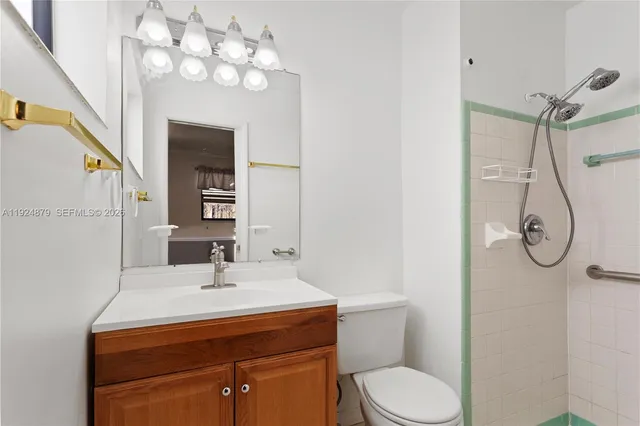 a view of a bathroom from a hallway with toilet