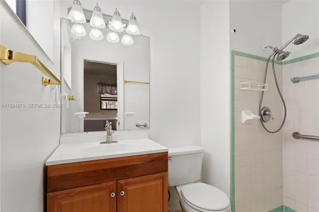 a bathroom with a glass shower door