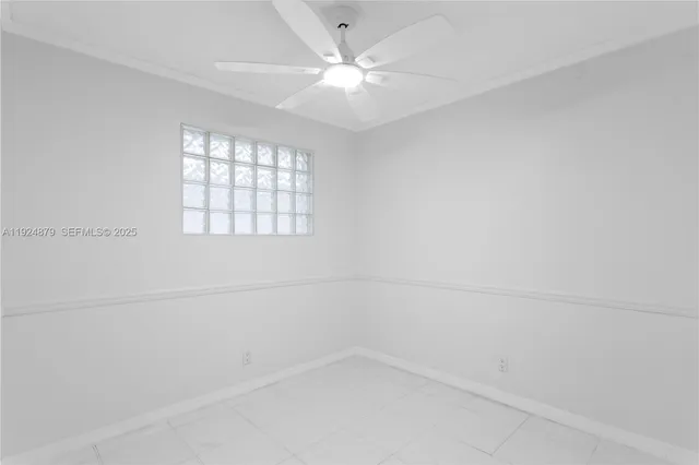 a kitchen with a refrigerator a stove top oven and cabinets