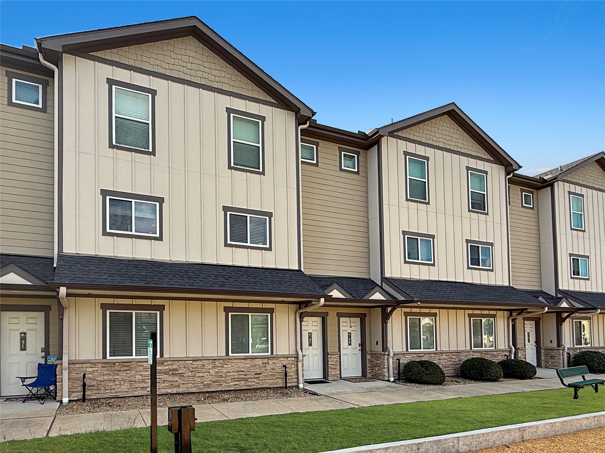 12603 Telge Road, Unit 8EH Cypress, TX 77429 - Photo 2 of 32 a front view of a house with a yard