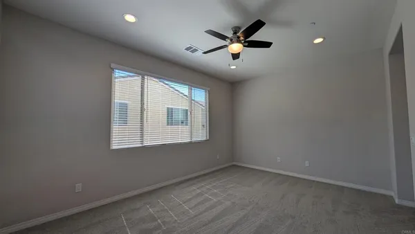a bathroom with a tub a sink and a large mirror