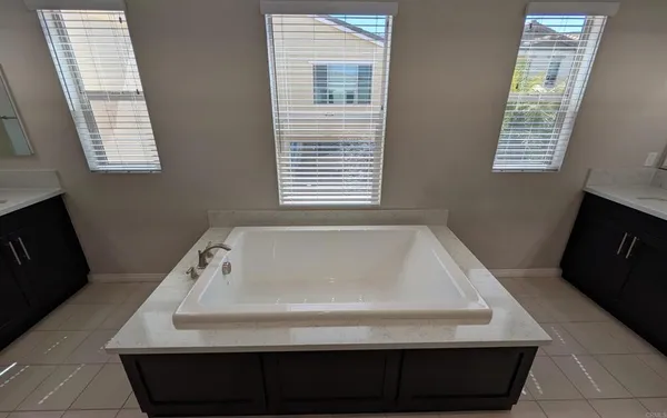 a bathroom with a sink vanity and a mirror