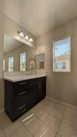 a white toilet sitting next to a bathroom sink