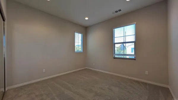 a bathroom with a sink double vanity and a mirror