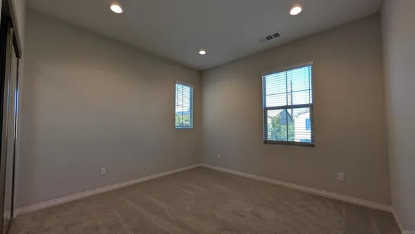 a bathroom with a toilet and a bath tub