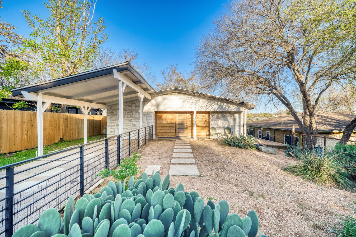 a front view of a house with garden