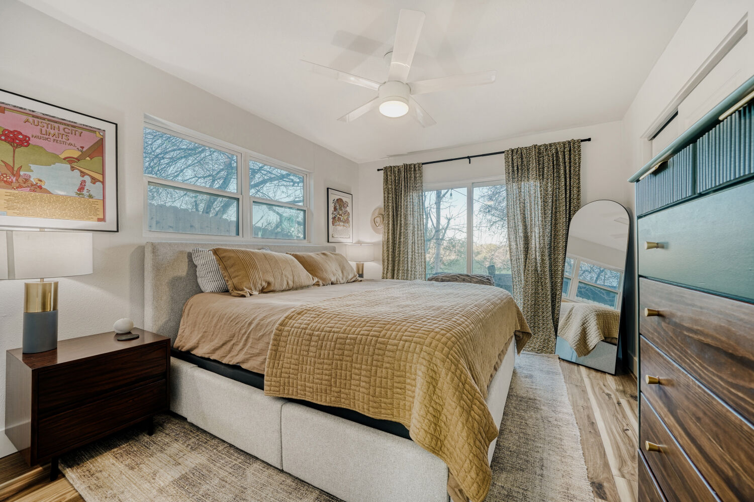 5313 Downs Drive Austin, TX 78721 - Photo 13 of 21 a bedroom with a large bed and a window