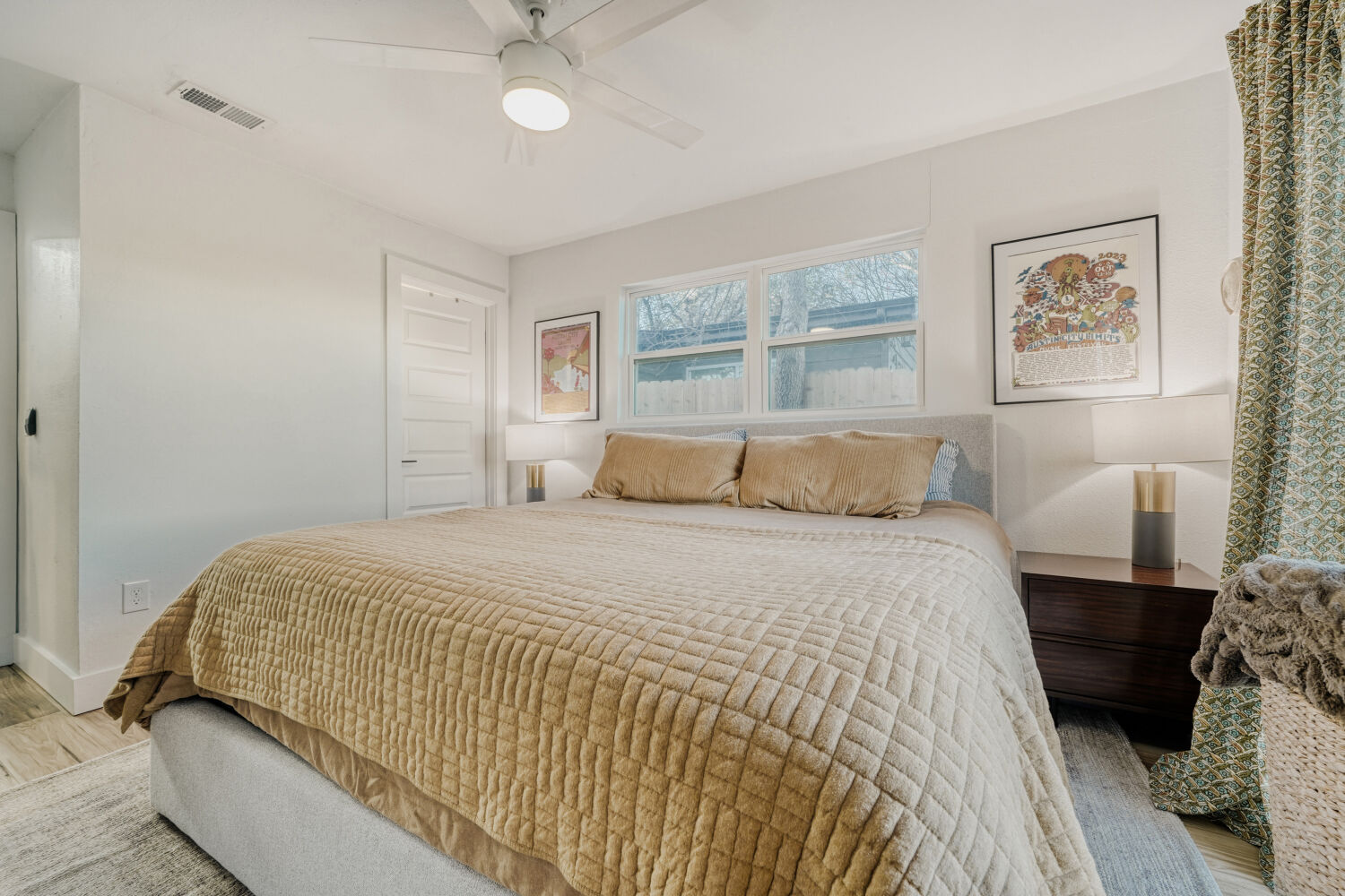 5313 Downs Drive Austin, TX 78721 - Photo 14 of 21 a bedroom with a bed and a large mirror