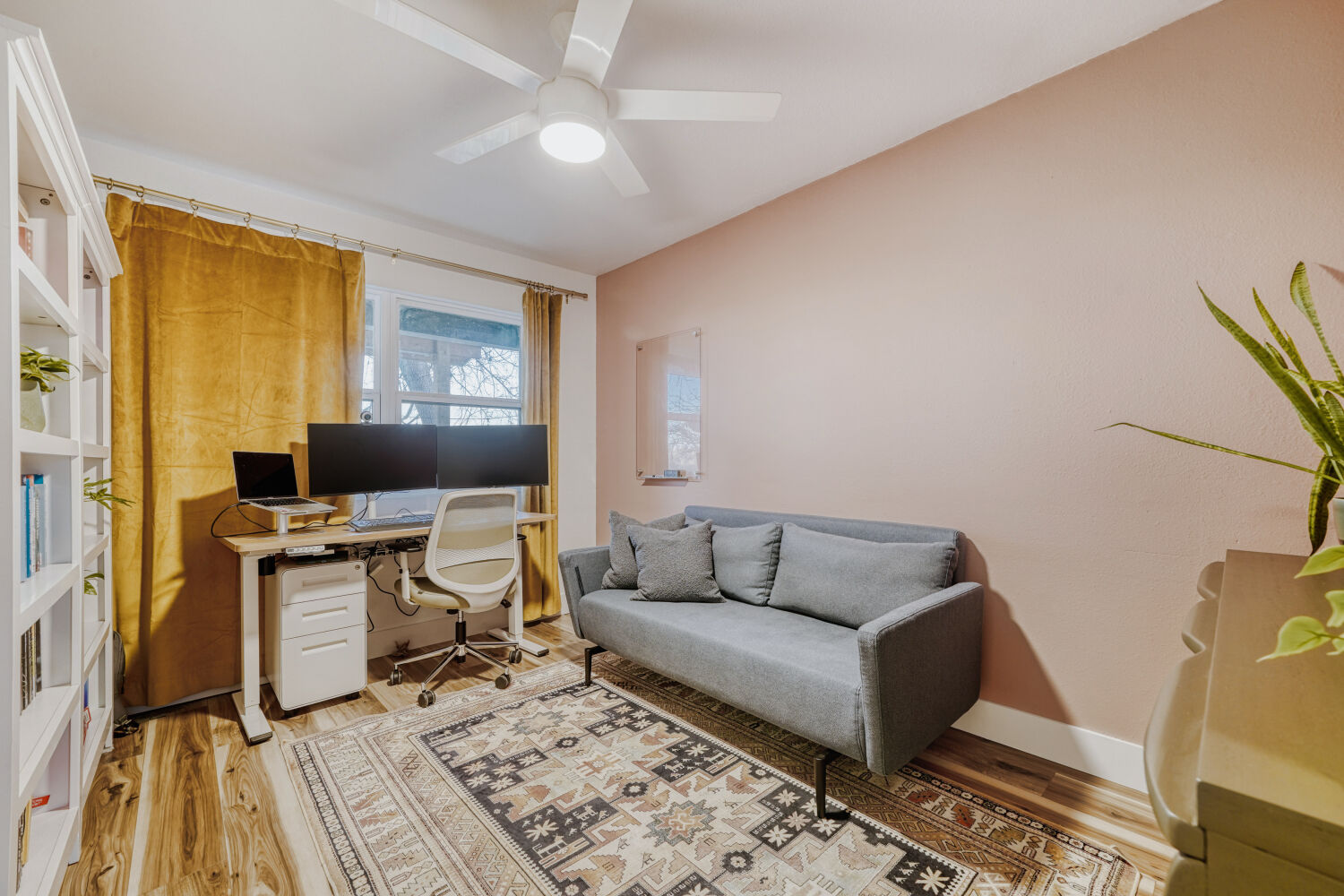 5313 Downs Drive Austin, TX 78721 - Photo 18 of 21 a living room with a couch and a flat screen tv