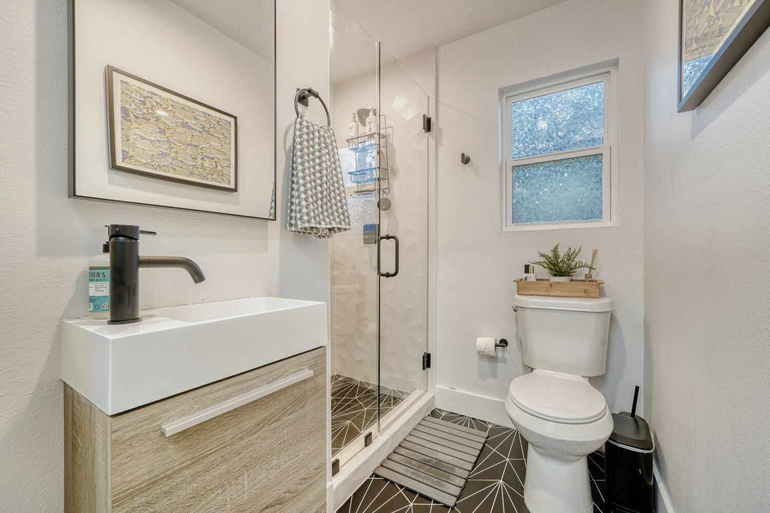 5313 Downs Drive Austin, TX 78721 - Photo 19 of 21 a bathroom with a sink toilet and shower