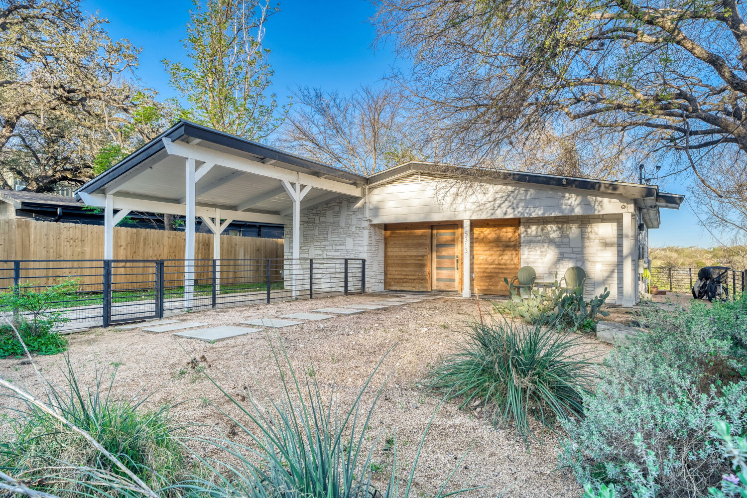 5313 Downs Drive Austin, TX 78721 - Photo 2 of 21 front view of a house with a small yard