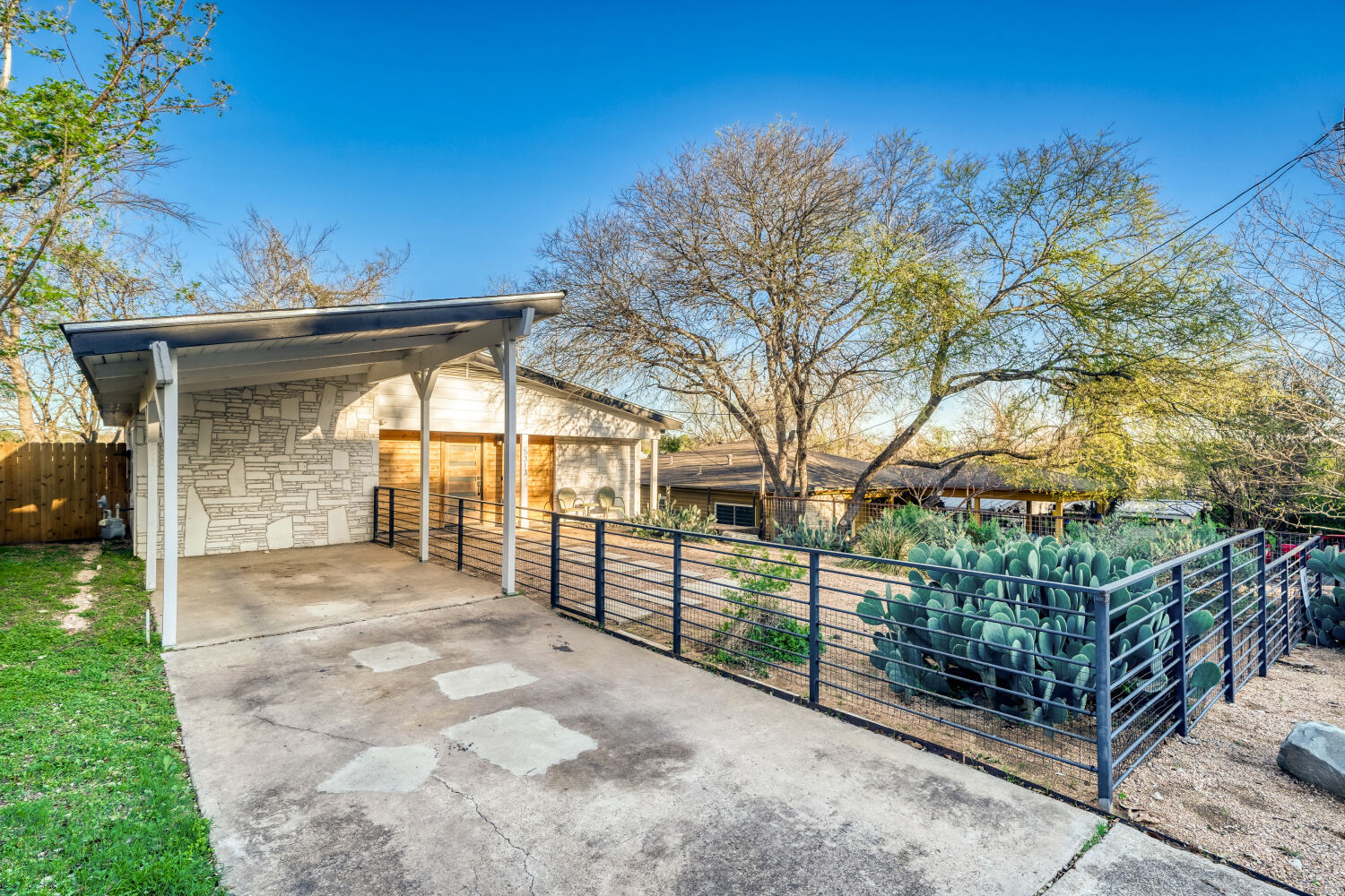 5313 Downs Drive Austin, TX 78721 - Photo 3 of 21 a view of a house with a yard