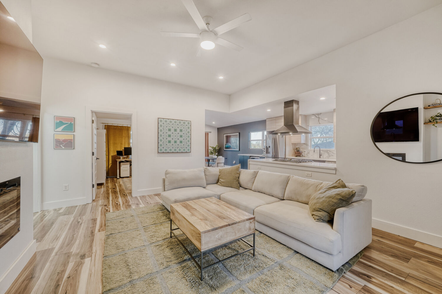 5313 Downs Drive Austin, TX 78721 - Photo 4 of 21 a living room with furniture a flat screen tv and a rug