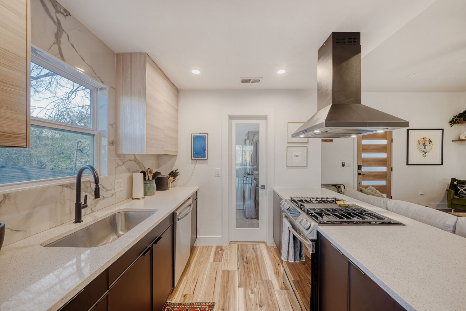 5313 Downs Drive Austin, TX 78721 - Photo 7 of 21 a kitchen with stainless steel appliances granite countertop a sink stove and refrigerator