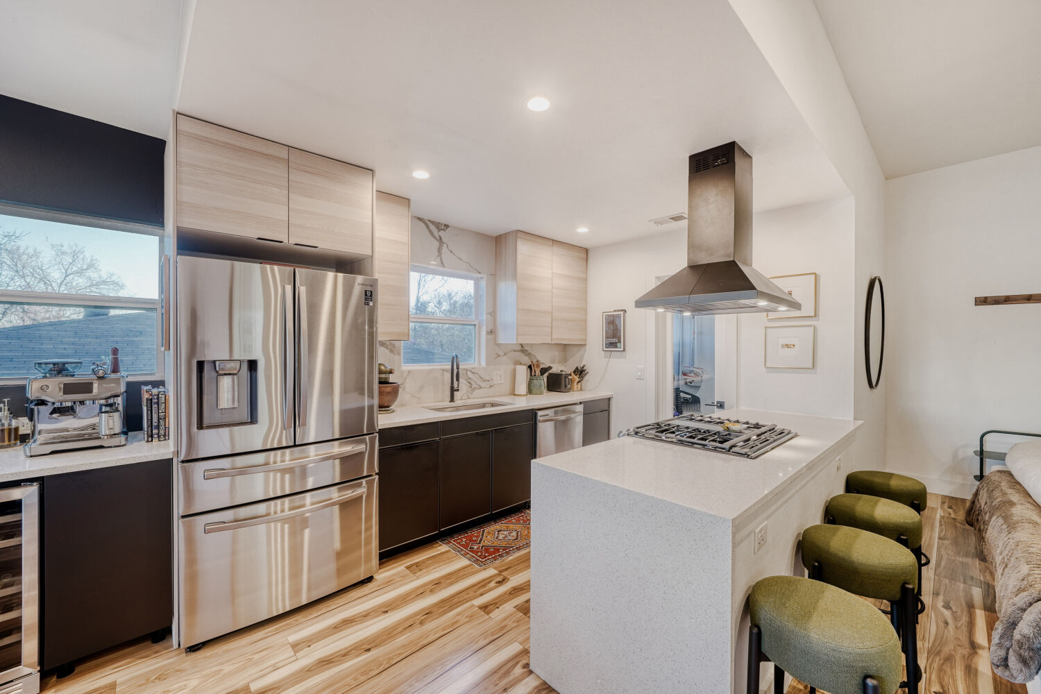 5313 Downs Drive Austin, TX 78721 - Photo 8 of 21 a kitchen with stainless steel appliances kitchen island a stove a refrigerator and a sink