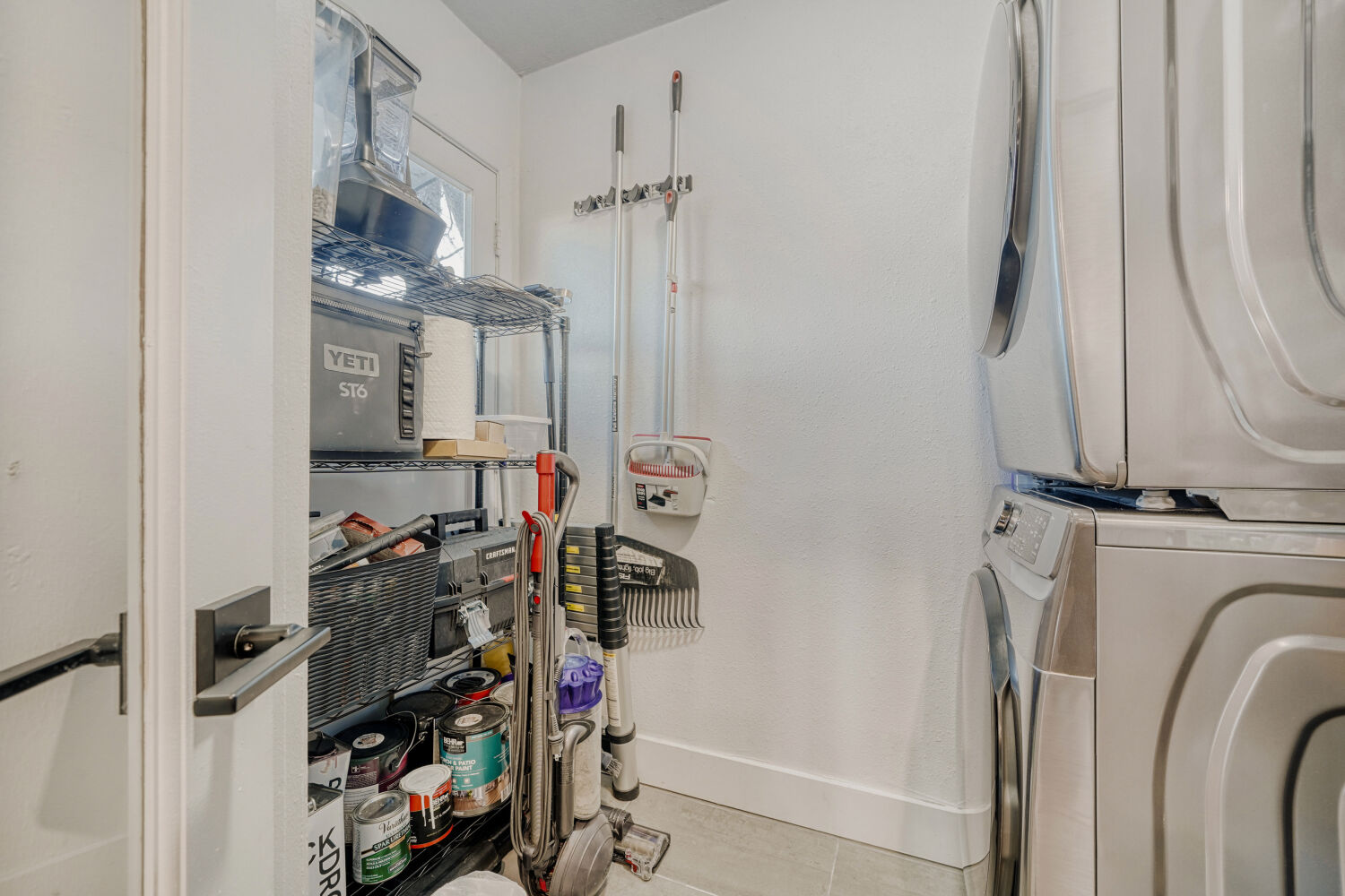 5313 Downs Drive Austin, TX 78721 - Photo 10 of 21 a view of walk in closet with clothes and shoes