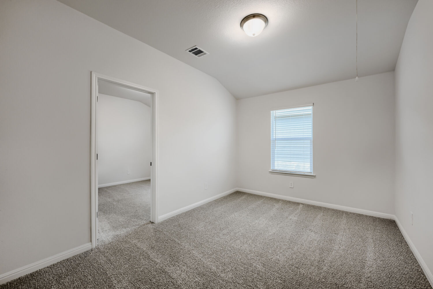 146 Diablo Rim Terrace Dripping Springs, TX 78620 - Photo 21 of 32 A well-lit bedroom with fresh carpeting and a bright window awaits your personal touch.