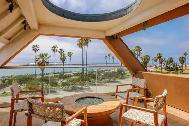 a view of a balcony with chairs